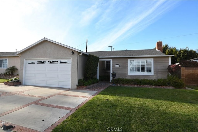 ranch-style home featuring a front lawn and a garage