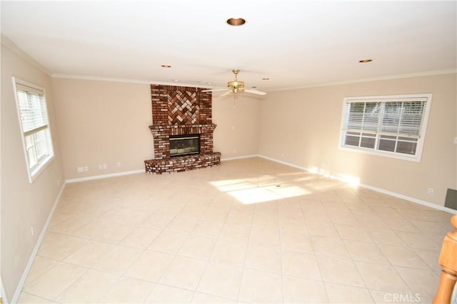 unfurnished living room with ceiling fan, a fireplace, and ornamental molding