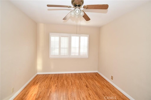 empty room featuring ceiling fan and light wood-type flooring