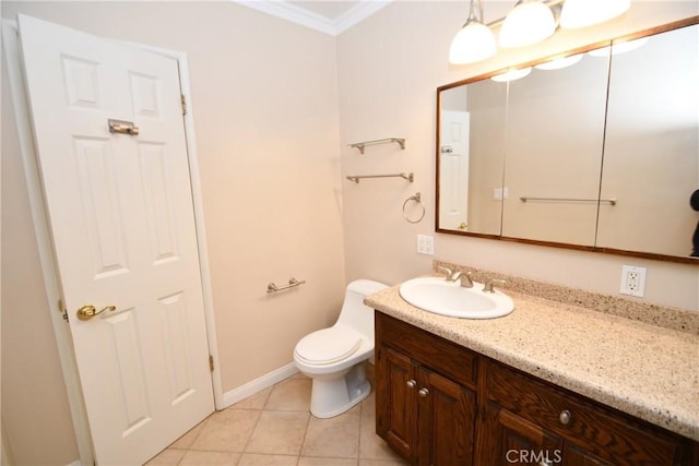 bathroom featuring toilet, vanity, crown molding, and tile patterned flooring