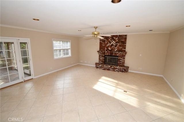 unfurnished living room featuring a brick fireplace, light tile patterned floors, crown molding, and ceiling fan