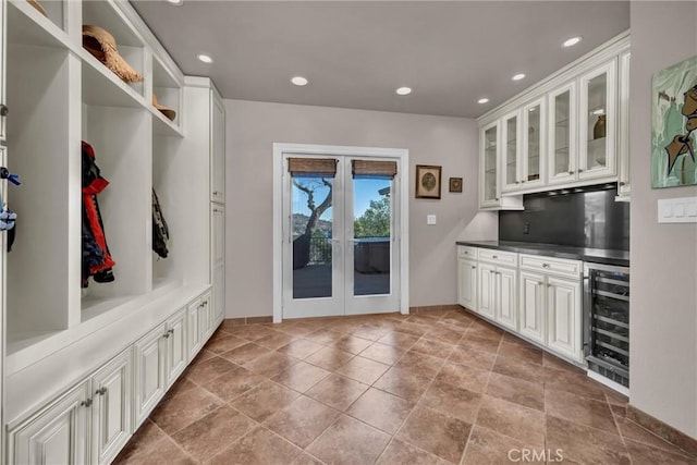 mudroom with wine cooler and french doors