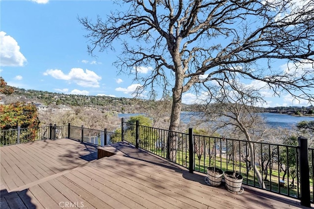 wooden terrace with a water view