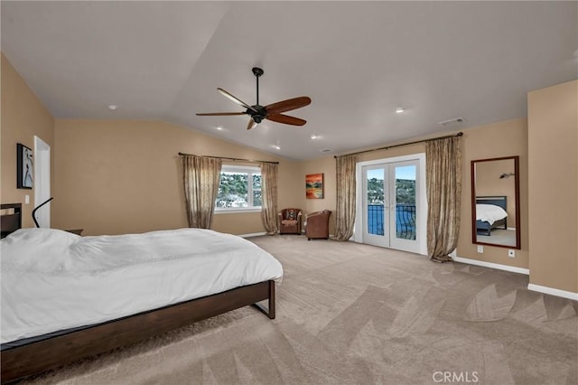 carpeted bedroom featuring access to exterior, vaulted ceiling, ceiling fan, and french doors