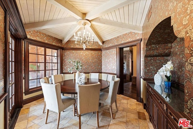 dining room with beamed ceiling and a notable chandelier