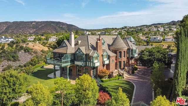 rear view of property with a mountain view