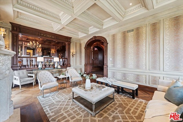 living room featuring parquet floors, an inviting chandelier, and ornamental molding