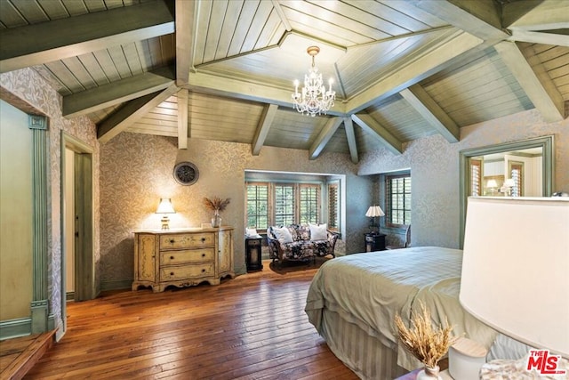 bedroom with lofted ceiling, dark hardwood / wood-style floors, and a chandelier