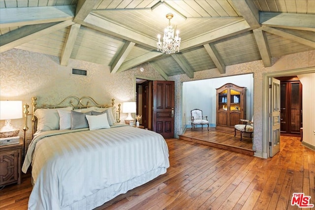 bedroom featuring vaulted ceiling with beams, an inviting chandelier, and hardwood / wood-style floors