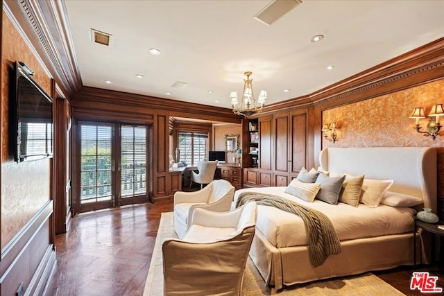 bedroom featuring access to outside, an inviting chandelier, crown molding, dark parquet floors, and french doors