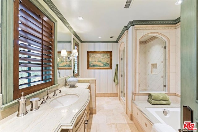 bathroom with vanity, ornamental molding, and shower with separate bathtub