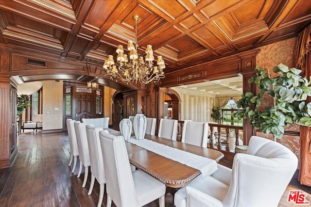 dining area with wood ceiling, a wealth of natural light, crown molding, and coffered ceiling