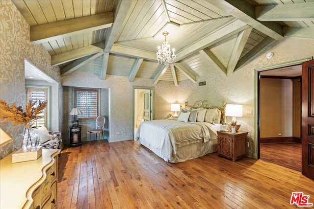 bedroom featuring vaulted ceiling with beams, wood-type flooring, and an inviting chandelier