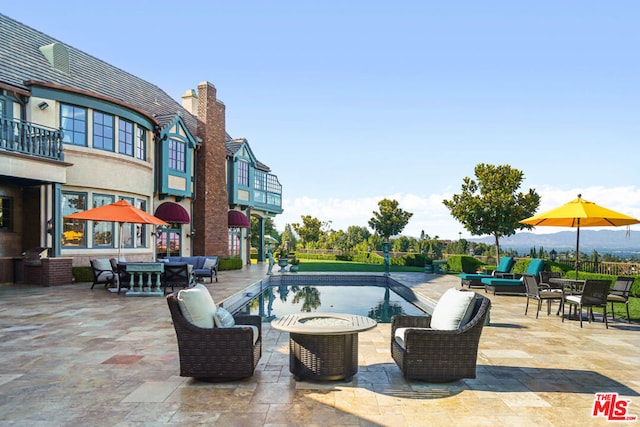 view of swimming pool featuring a patio