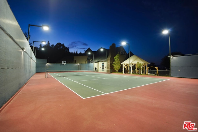 view of sport court with a gazebo and basketball hoop