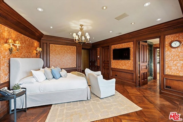 bedroom featuring ornamental molding, dark parquet flooring, and a notable chandelier