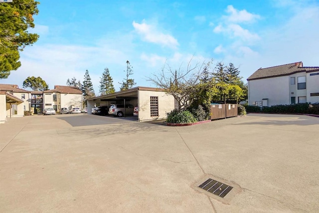 exterior space with a carport