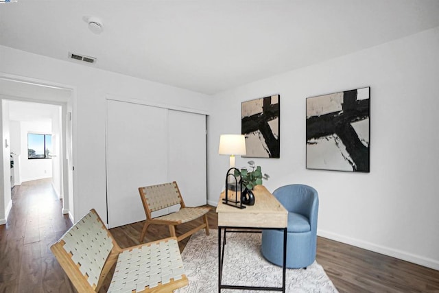 living area with dark hardwood / wood-style flooring