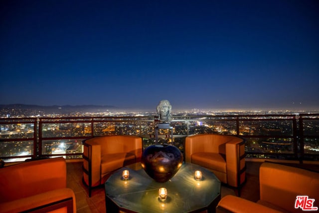 view of balcony at twilight