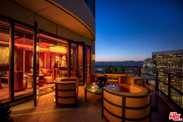 view of patio terrace at dusk