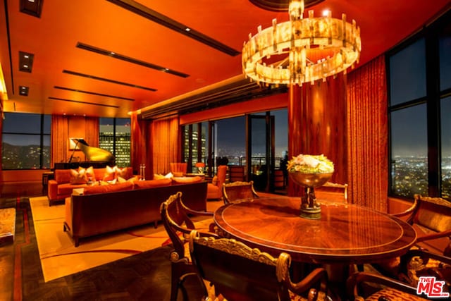 dining room featuring parquet floors and an inviting chandelier