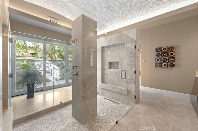 bathroom with a shower with door