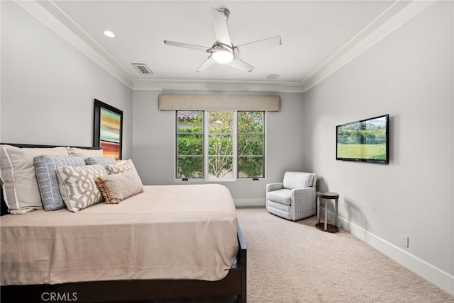 carpeted bedroom featuring crown molding and ceiling fan