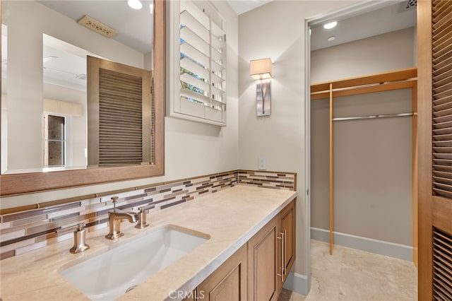 bathroom featuring vanity, decorative backsplash, and tile patterned floors