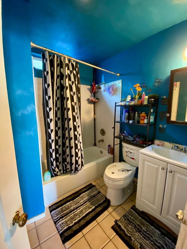 full bathroom featuring vanity, toilet, tile patterned floors, and shower / tub combo with curtain