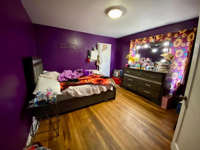 bedroom with hardwood / wood-style floors