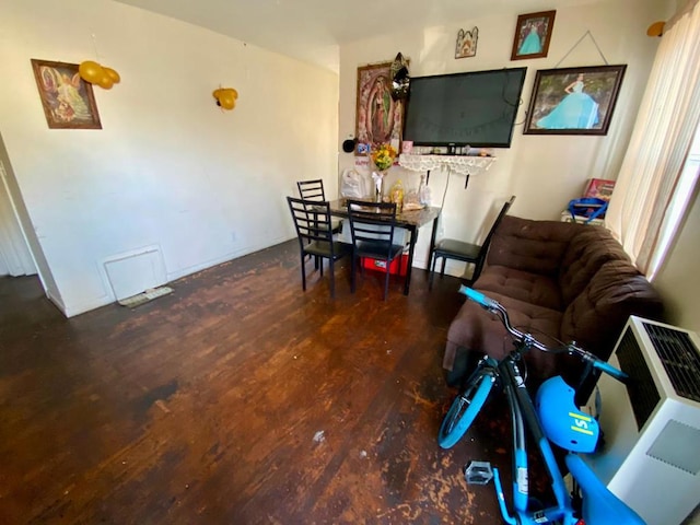 living room featuring dark wood-type flooring