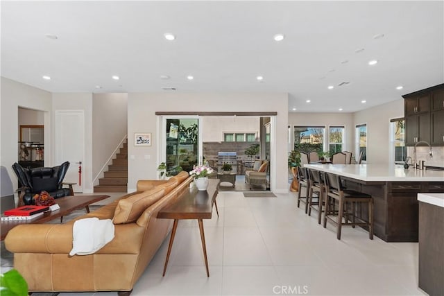 living room featuring light tile patterned flooring