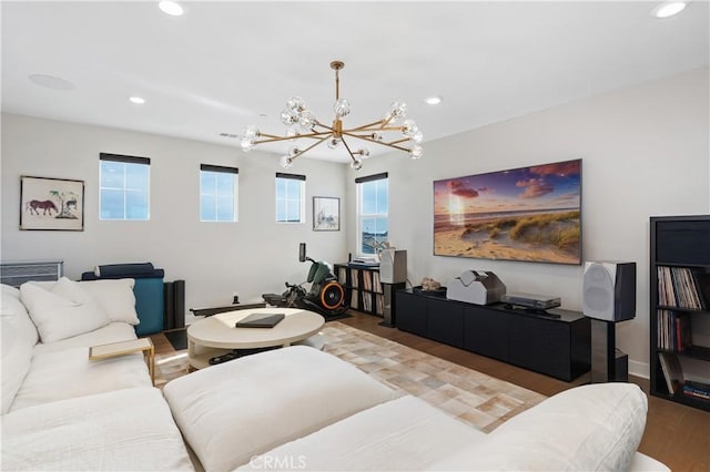 living room featuring a chandelier and hardwood / wood-style floors