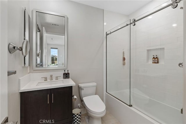 full bath featuring visible vents, bath / shower combo with glass door, toilet, and vanity