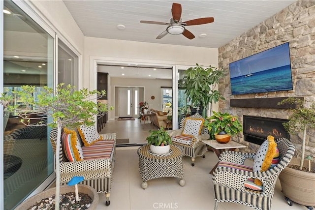 interior space featuring a fireplace and ceiling fan