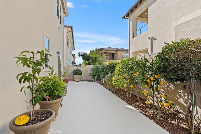 view of patio featuring fence