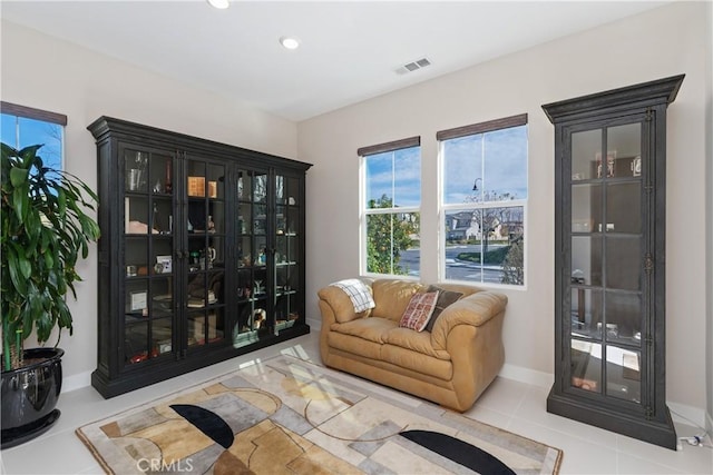 living area with light tile patterned floors