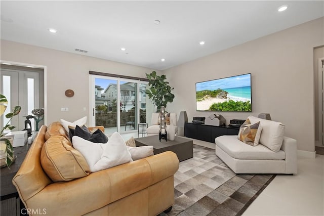 living room featuring recessed lighting and visible vents