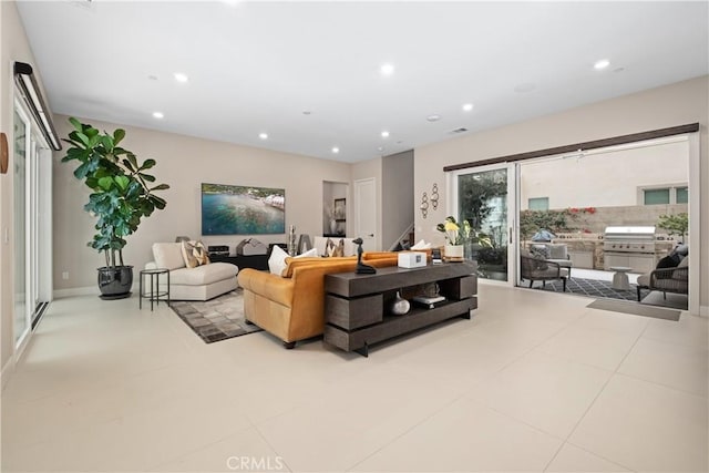 tiled living room with stairway, recessed lighting, and visible vents