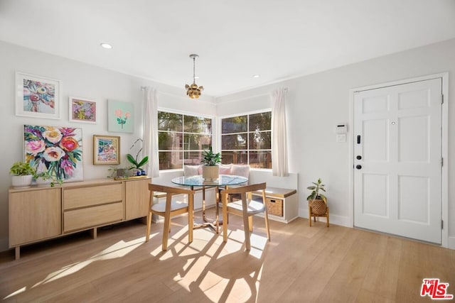 dining room featuring light hardwood / wood-style floors and breakfast area