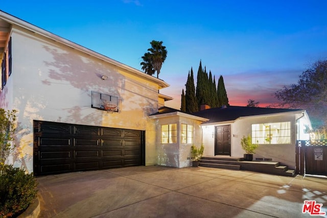 view of front of property with a garage