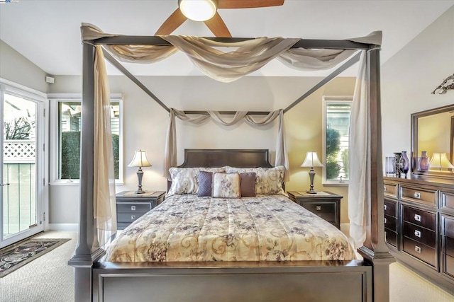 bedroom with ceiling fan and light colored carpet