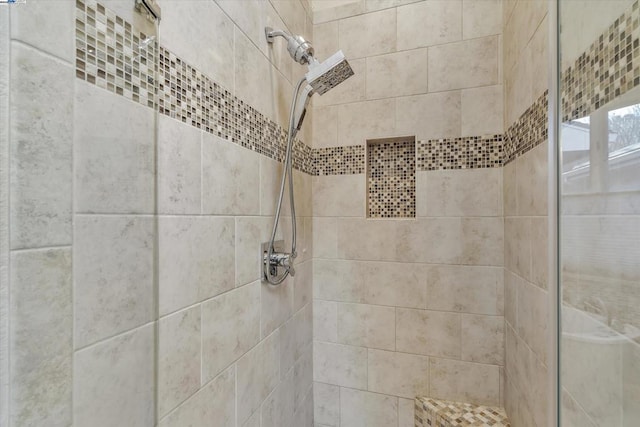 bathroom with tiled shower