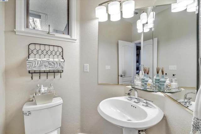 bathroom with sink and toilet