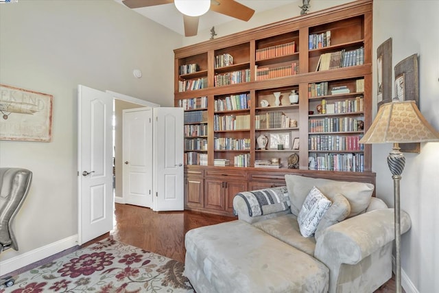 sitting room featuring dark wood-type flooring