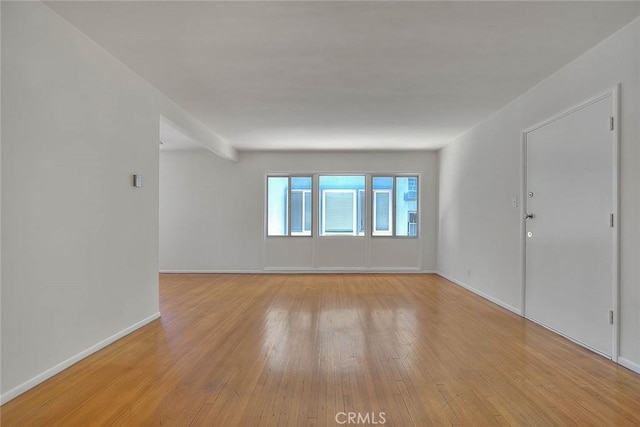 unfurnished room with light hardwood / wood-style flooring