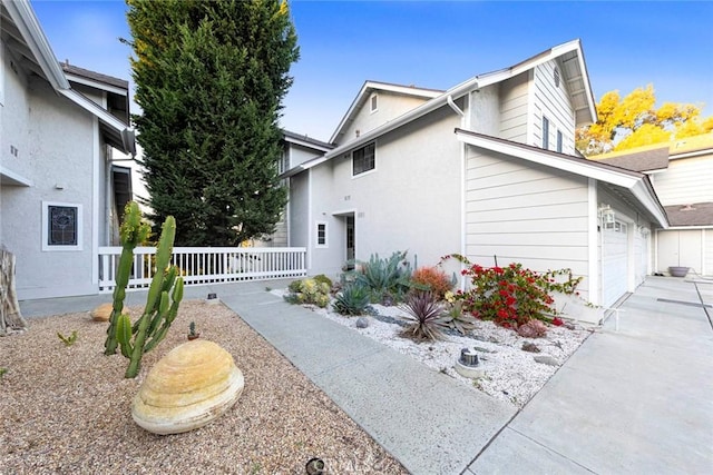 view of side of home featuring a garage