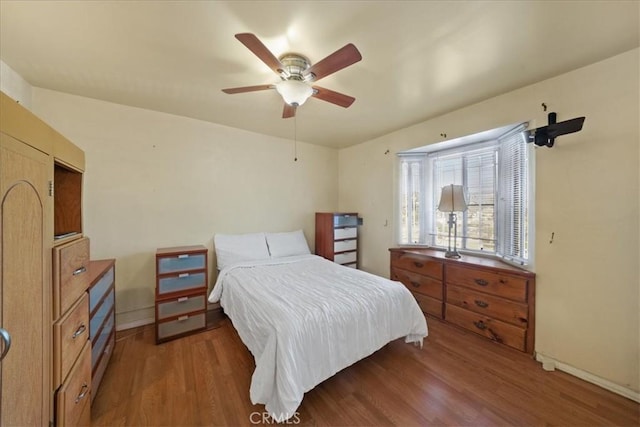 bedroom featuring ceiling fan and wood-type flooring