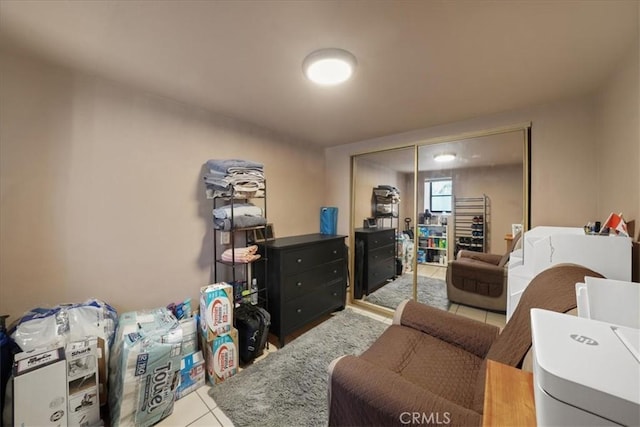 interior space featuring light tile patterned floors and a closet