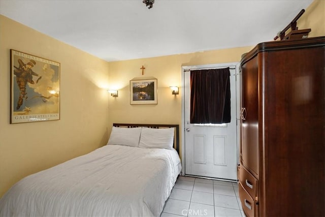 bedroom featuring light tile patterned flooring